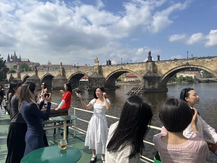 Students conducting reporting work in Prague